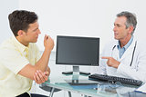 Doctor in conversation with patient at office