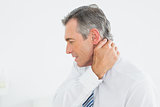 Mature man suffering from neck pain