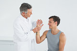 Doctor examining a patients hand