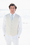 Groom smiling at camera with hands in pockets