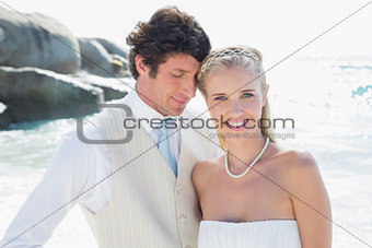 Happy bride and groom embracing
