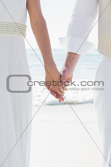 Newlyweds holding hands close up