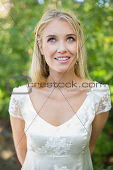 Happy beautiful bride looking up