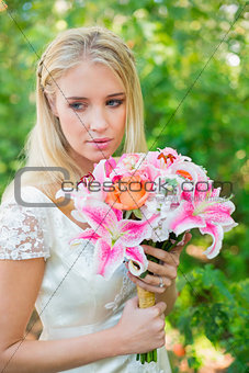 Calm bride holding her bouquet