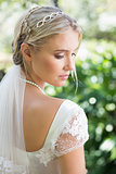 Blonde bride in a veil rear view