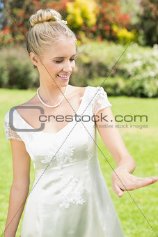 Happy bride looking at her ring