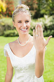 Happy bride showing her ring
