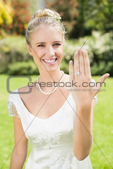 Happy bride showing her ring