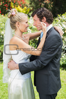 Happy wife touching her new husbands cheek