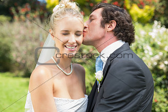 Husband kissing his new wife on the cheek