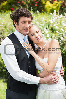 Romantic happy newlywed couple embracing each other