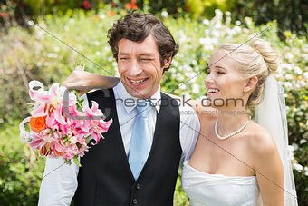 Romantic newlywed couple smiling on their wedding day