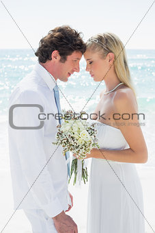 Smiling couple embracing each other on their wedding day