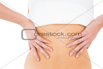 Mid section of a woman suffering from back pain
