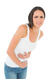 Casual young woman with stomach pain