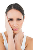 Close-up of a casual woman suffering from headache
