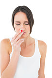 Casual young woman with bleeding nose