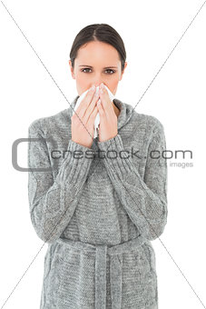 Portrait of a casual woman suffering from cold