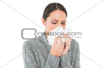 Casual young woman suffering from cold