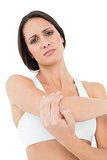 Portrait of a fit young woman with elbow pain