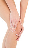 Close-up mid section of a woman with knee pain