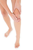 Close-up low section of a fit woman with leg pain