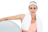 Portrait of a fit woman holding fitness ball