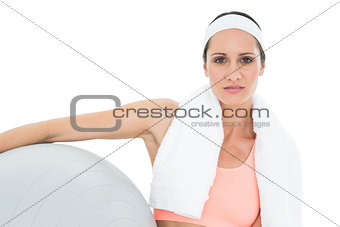 Portrait of a fit woman holding fitness ball