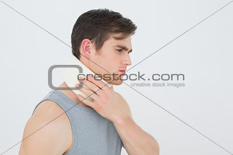 Side view of a young man wearing cervical collar
