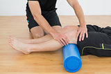 Man getting his knee examined by a physical therapist
