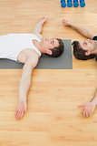 Physical therapist and man relaxing with eyes closed