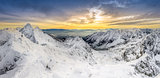 Panoramic view of winter mountains at sunset