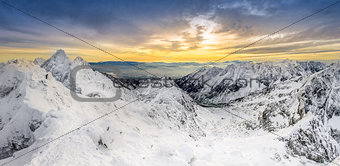 Panoramic view of winter mountains at sunset