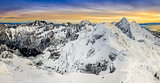 Panoramic view of winter mountains at colorful sunset