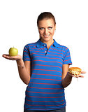 Woman with hamburger and apple