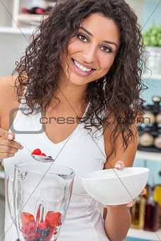 Woman Making Fruit Smoothie in Kitchen