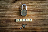 Old vintage padlock and key with secret sign