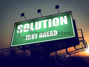 Solution Just Ahead on Green Billboard.