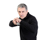 man changing channel with a remote control