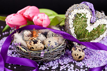 pink tulips and brown eggs with purple ribbon easter decoration