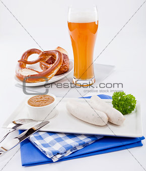 weisswurst white sausages and sweet mustard with pretzel 