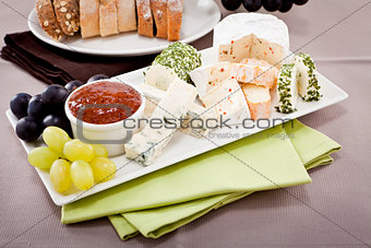 cheese plate with grapes and wine dinner