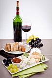 cheese plate with grapes and wine dinner