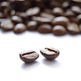 Big Heap of Brown Coffee Beans Isolated on White Background