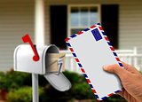 Hand Holding Envelope and Postal Box