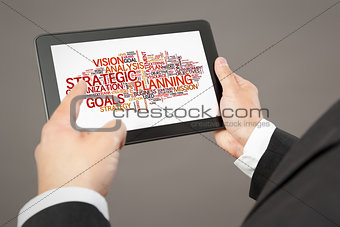 business man pointing to a tablet pc