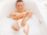 Closeup on young woman washing in bathtub