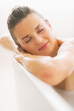 Portrait of relaxed young woman in bathtub