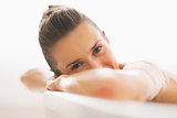 Young woman relaxing in bathtub