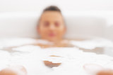 Closeup on young woman in bathtub